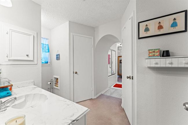 Primary Bath was customized with an arch entryway into a beautiful area with a Vanity. | Image 21
