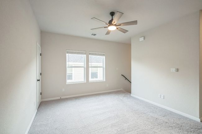 Unfurnished room featuring ceiling fan, carpet, and baseboards | Image 13