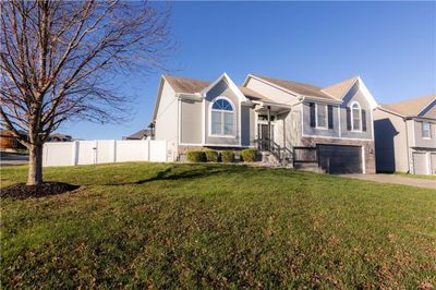 View of front of property featuring a garage and a front lawn | Image 3