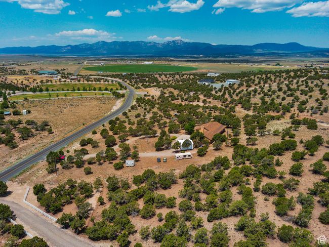Aerial view of sparsely populated area with a mountain backdrop | Image 53