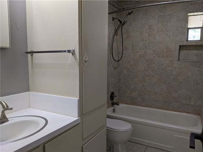 Full bathroom with vanity, tub / shower combination, and tile patterned floors | Image 6