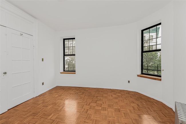 Unfurnished bedroom featuring baseboards | Image 12