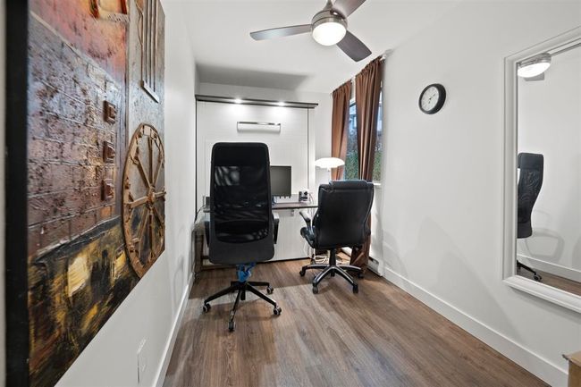 Office area with ceiling fan, wood finished floors, and baseboards | Image 12