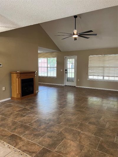 Living Room w free standing FP and ceiling fan | Image 3