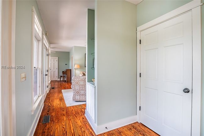 Hallway featuring hardwood / wood-style floors | Image 23