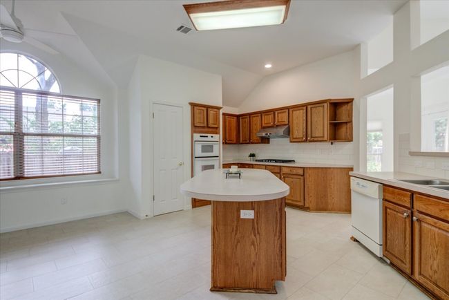 Kitchen has new tile backsplash | Image 8