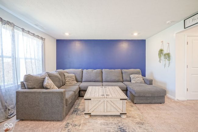 carpeted living area with recessed lighting | Image 10