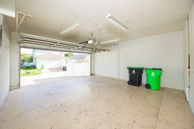 Garage with a garage door opener | Image 36