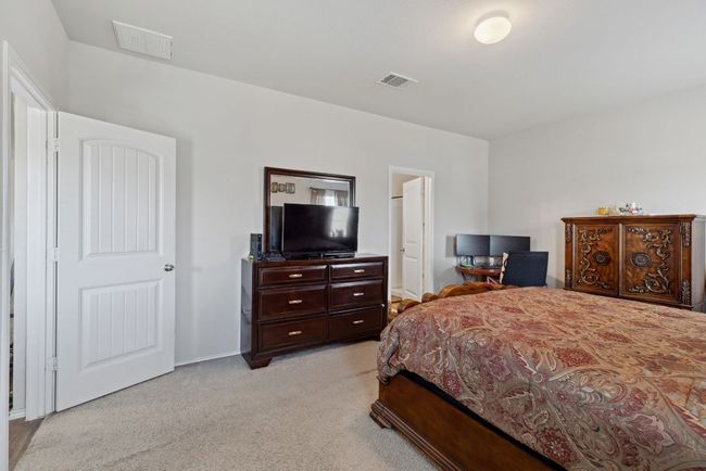 Bedroom with light carpet and baseboards | Image 28