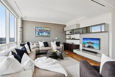 Living room with hardwood / wood-style floors, plenty of natural light, and crown molding | Image 3