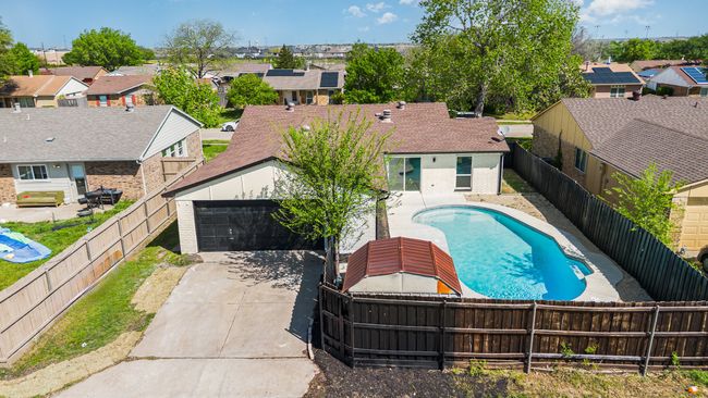 View of swimming pool featuring a residential view and a fenced backyard | Image 29