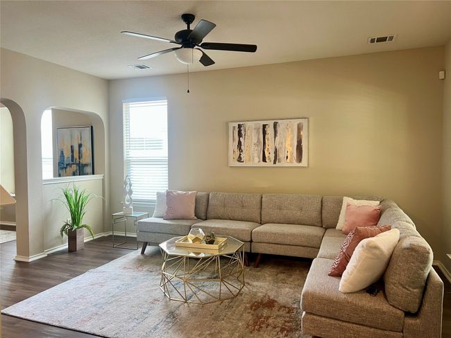 Cozy living room with lots of natural light. | Image 6