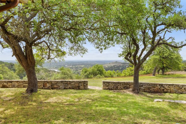 View of community featuring a lawn | Image 29