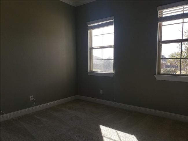 Spare room with dark colored carpet and plenty of natural light | Image 8