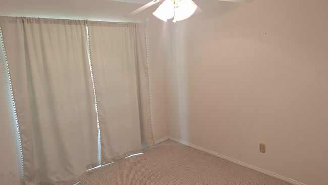 Empty room featuring carpet flooring and a ceiling fan | Image 21