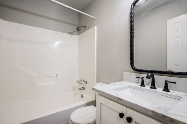 Bathroom with vanity and shower combination | Image 20