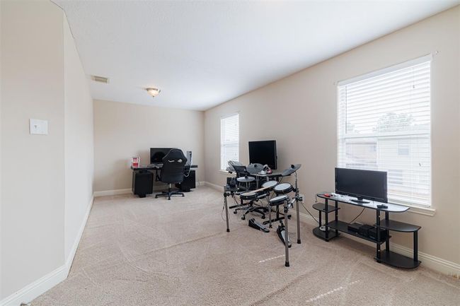 Large study with double doors located upstairs, could also be used a media room. | Image 28