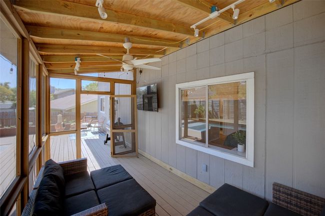 The lovely screened-in porch offers a third living space to enjoy! | Image 30