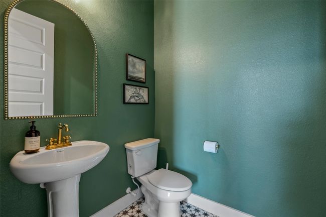 Elegant 1/2 bath just off the office. | Image 22