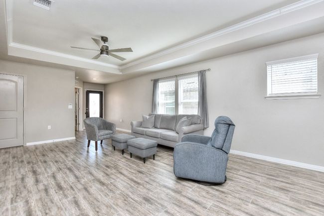 Great Room has ceiling fan already installed. | Image 12