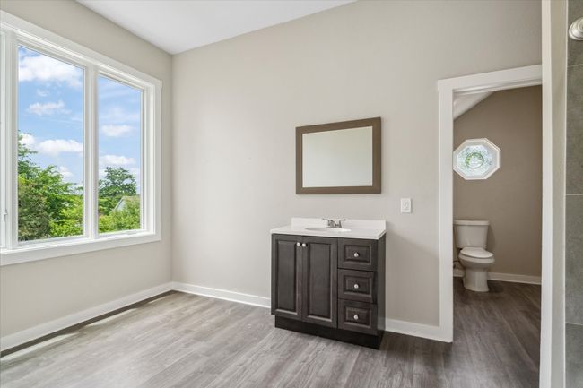 Bathroom with wood finished floors, plenty of natural light, and vanity | Image 30