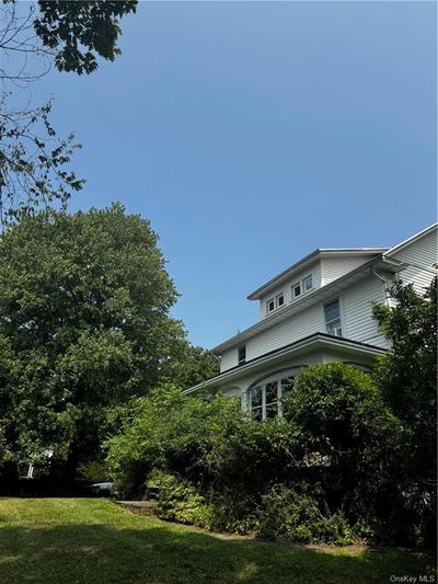 View of side of home with a lawn | Image 3