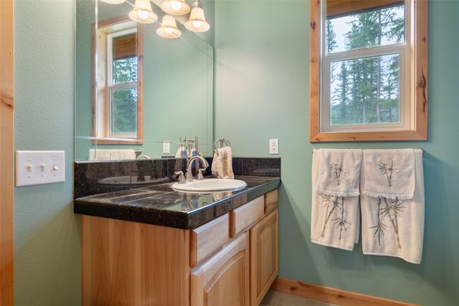Bathroom featuring vanity and a textured wall | Image 50