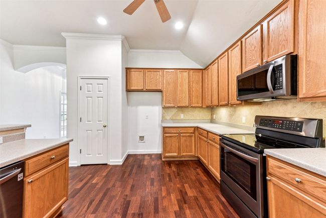 Another view of large kitchen open to the family and dining area | Image 20