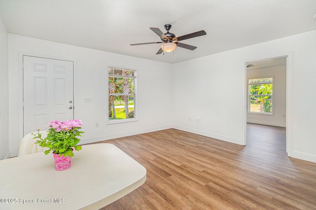 Both units have plenty of natural light. This is Unit #1232. Open door to the righ is door leading to first of the 2 bedrooms. | Image 6