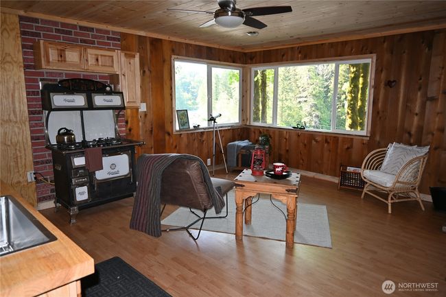 The cottage boasts numerous upgrades: roof, fresh paint, updated windows, permitted 4C electrical panel, and a generator w/automatic transfer switch. | Image 17