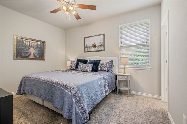Bedroom featuring carpet floors and a ceiling fan | Image 18
