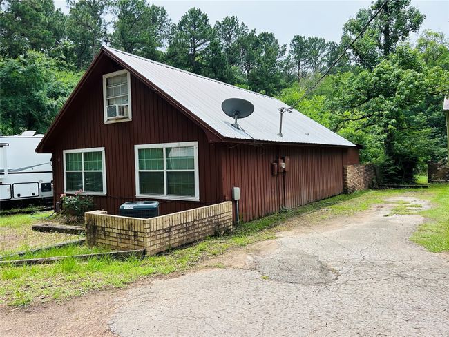 View of home's exterior featuring a metal roof | Image 5