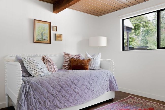 Bedroom featuring wood ceiling, beam ceiling, multiple windows, and wood finished floors | Image 8