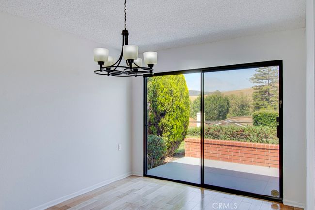 Dining room has direct access to the rear patio. | Image 10