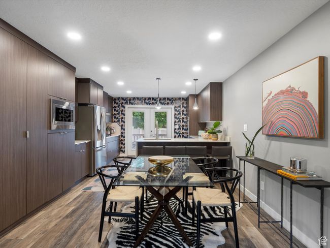 Dining space featuring french doors, light wood-style flooring, and recessed lighting | Image 14