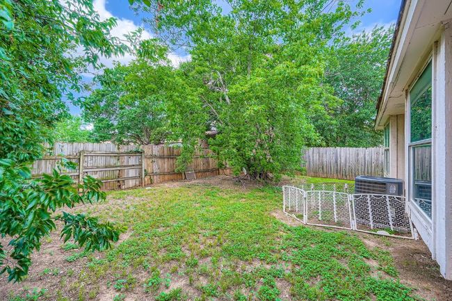 View of fenced backyard | Image 24