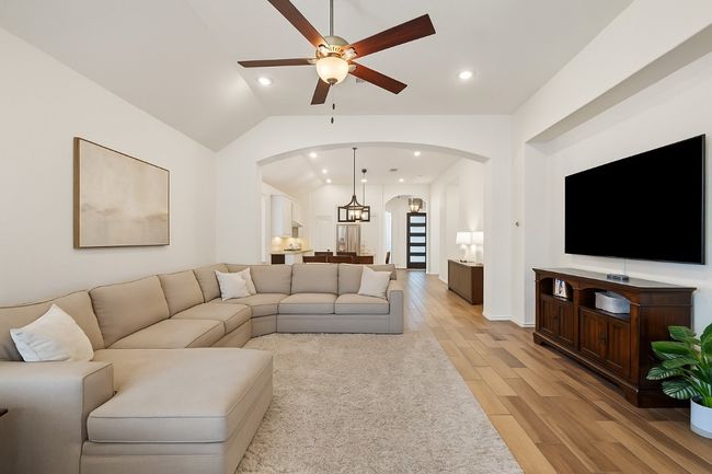Elegant archways create a graceful flow from the living room to the dining and kitchen areas, adding architectural charm and an open-concept feel. | Image 16