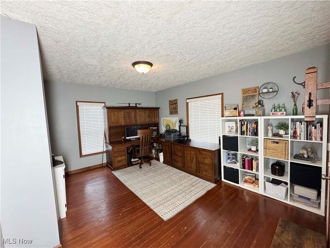 Office featuring wood-type flooring and a textured ceiling | Image 9