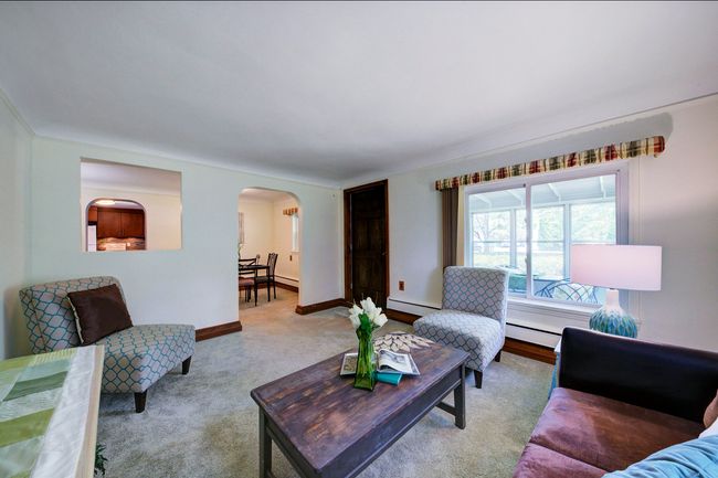 Living room with adjacent dining room. | Image 4