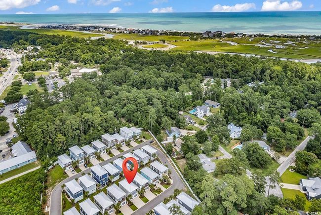 Aerial view of property's location with a large body of water and nearby suburban area | Image 33