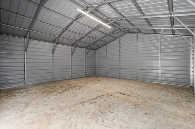Garage featuring metal wall | Image 30