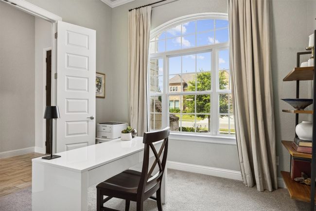 Stunning arched window with light streaming through is the star of this room | Image 4