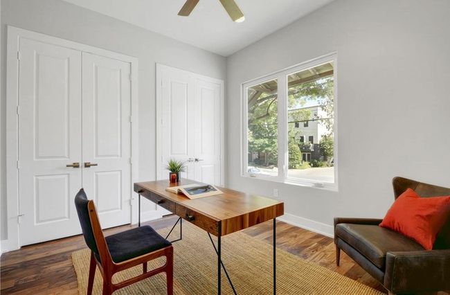 Home office with baseboards, ceiling fan, and wood finished floors | Image 20