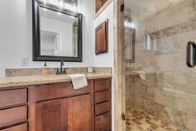 Primary bathroom with glass shower door. | Image 25