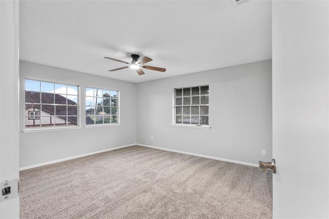 Wake up every morning in your peaceful primary bedroom retreat. | Image 16