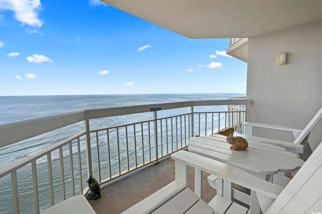 Balcony with a beach view and a water view | Image 32