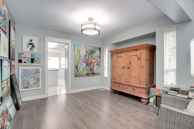 Entryway with baseboards and wood finished floors | Image 6