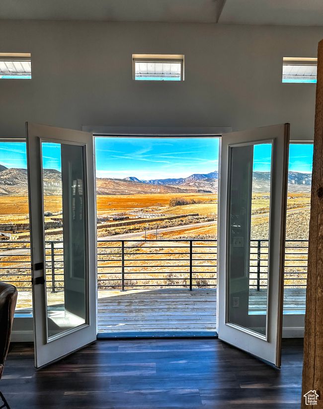 Doorway to outside featuring plenty of natural light, a mountain view, and wood finished floors | Image 7