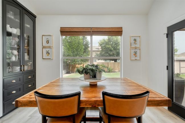 Dining room with light wood finished floors | Image 4