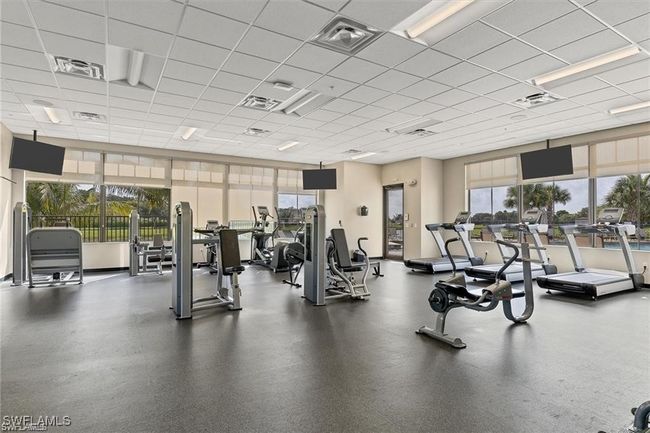 Exercise room featuring a paneled ceiling | Image 24